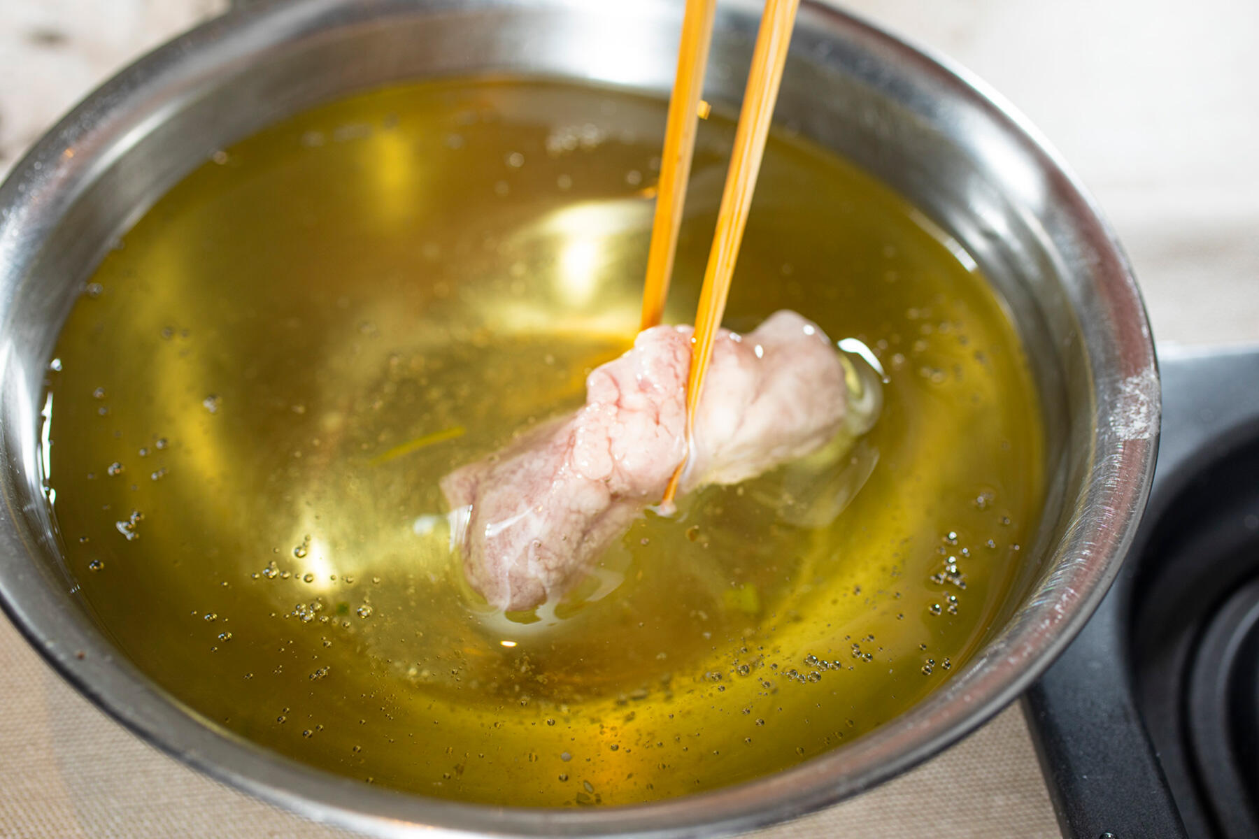 油にくぐらせる